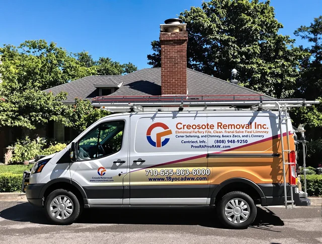 Wrentham Chimney Sweep technician removing creosote safely in Wrentham, MA