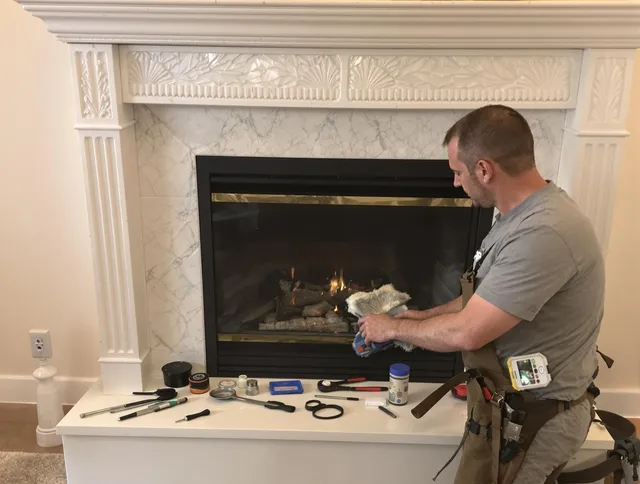 Wrentham Chimney Sweep performing fireplace maintenance in Wrentham, MA